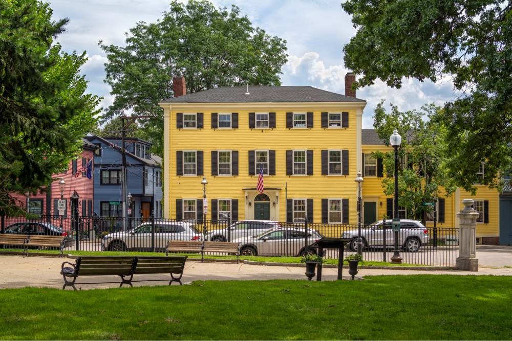 Bright yellow house on a street in Charlestown, MA