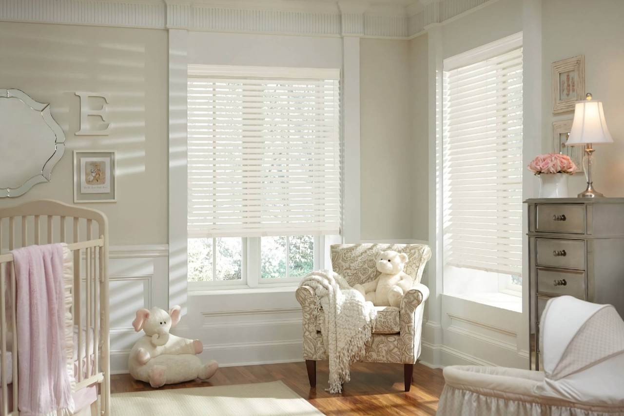 Cordless Hunter Douglas Parkland® Wood Blinds on windows in a neutral nursery with light pink accents at WTI near Concord Massachusetts (MA)